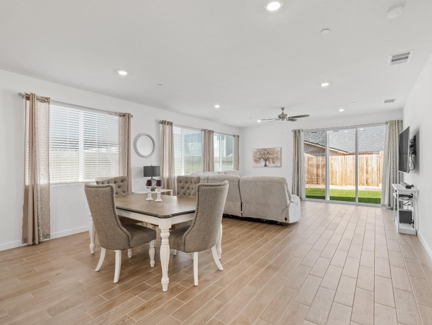 2682 Highland Avenue Clovis, CA 93619 - Photo 8 of 29 a view of a dining room with furniture and wooden floor