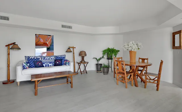a view of a dining room with furniture and a table