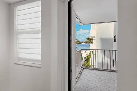 a kitchen with stainless steel appliances sink refrigerator and microwave