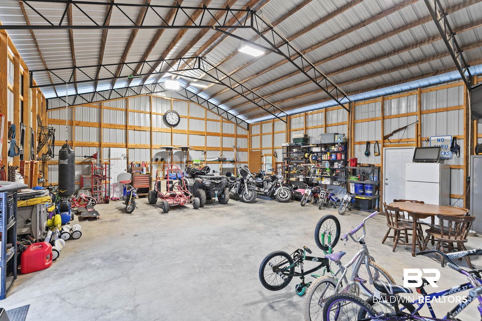 55750 Lottie Road Perdido, AL 36562 - Photo 39 of 84 Garage with metal wall and a workshop area