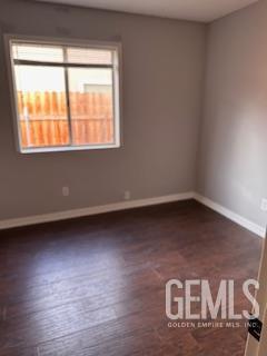 Undisclosed Address Tehachapi, CA 93561 - Photo 8 of 10 a view of an empty room with wooden floor and a window