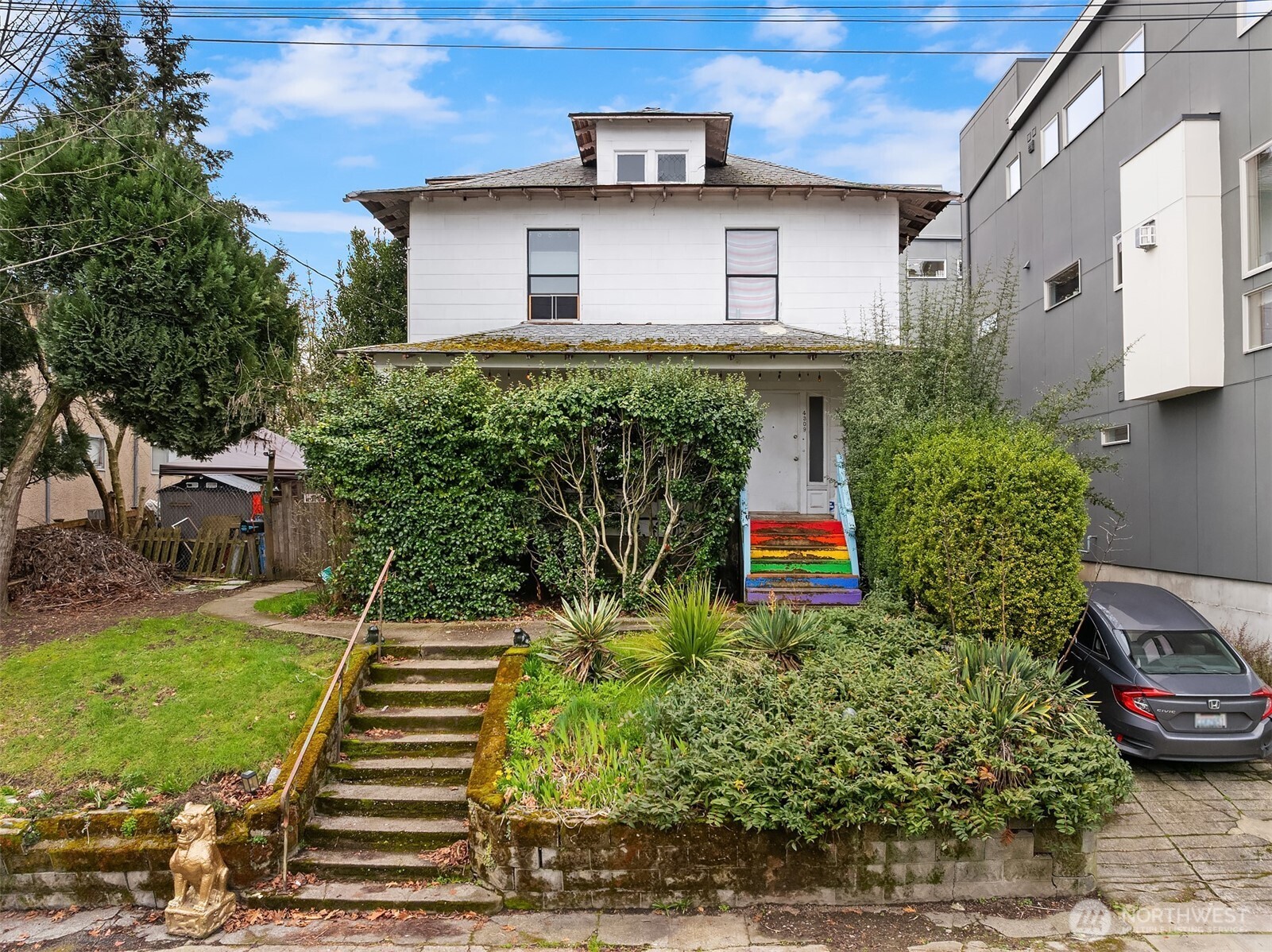 4309 Evanston Avenue North Seattle, WA 98103 - Photo 3 of 13 a front view of a house with garden