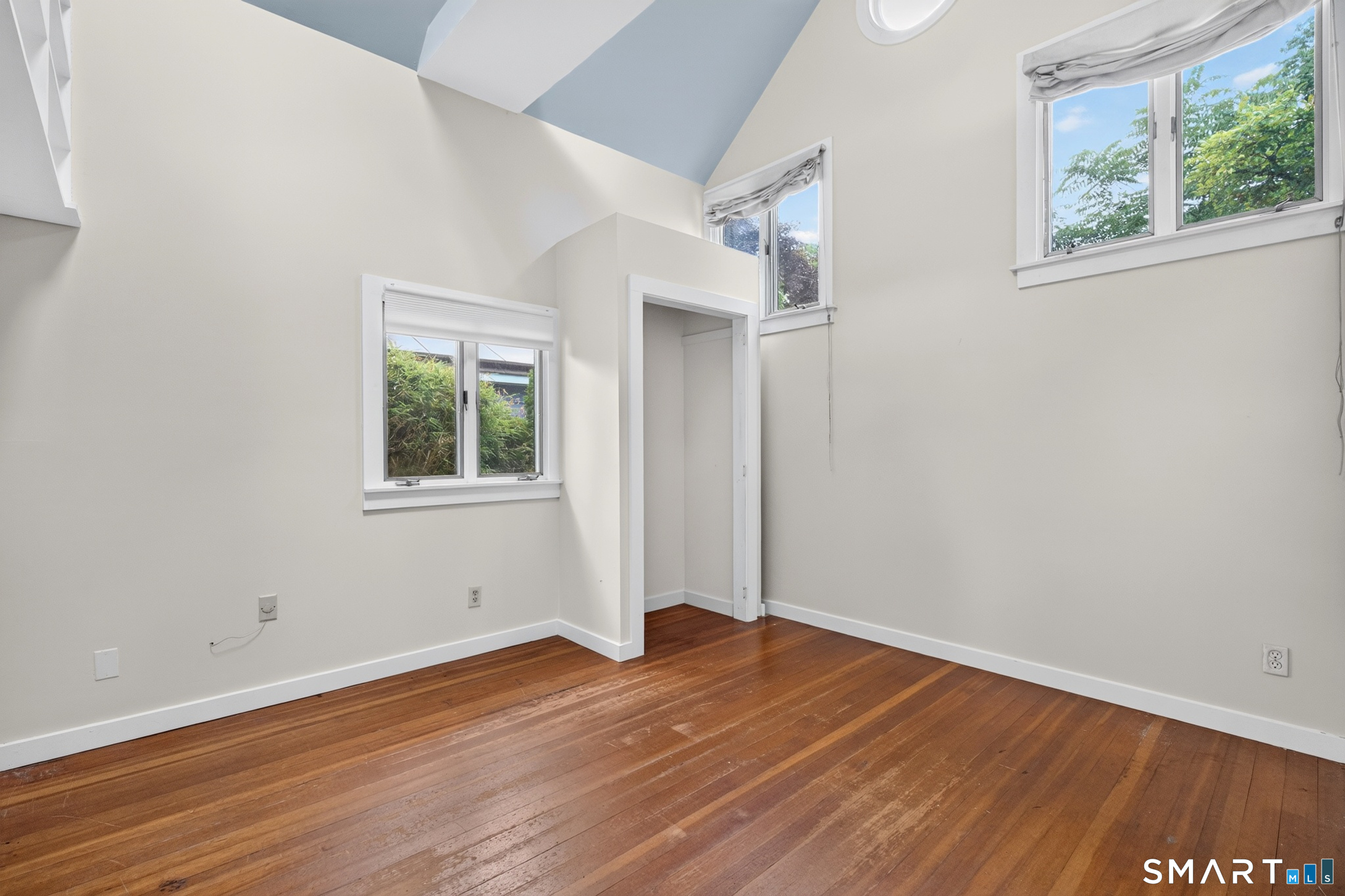 207 Pawson Road Branford, CT 06405 - Photo 23 of 39 Primary bedroom with high vaulted ceilings !
