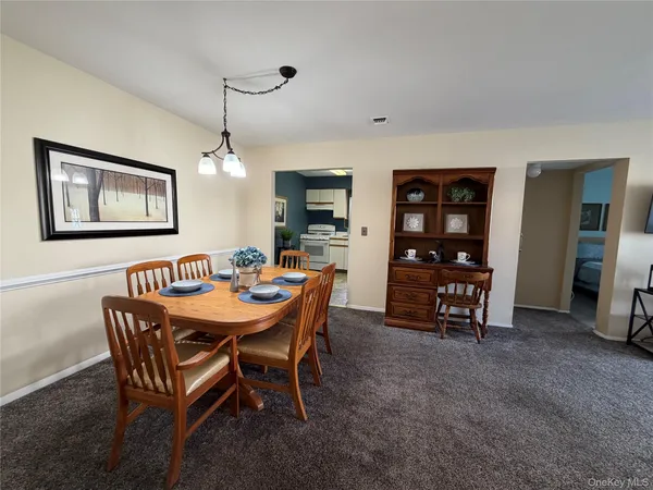 a dining room with furniture and window