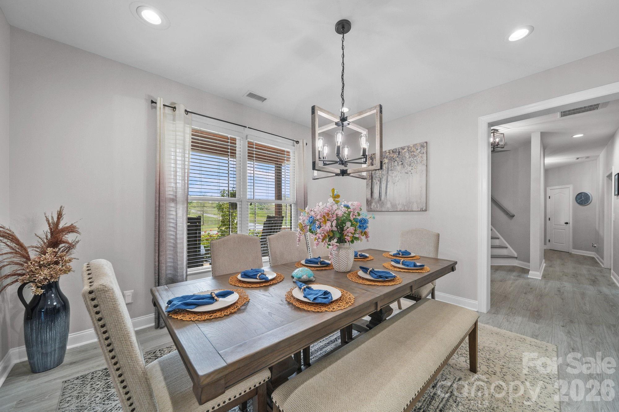 617 Caudle Road Peachland, NC 28133 - Photo 20 of 48 a view of a dining room with furniture window and wooden floor