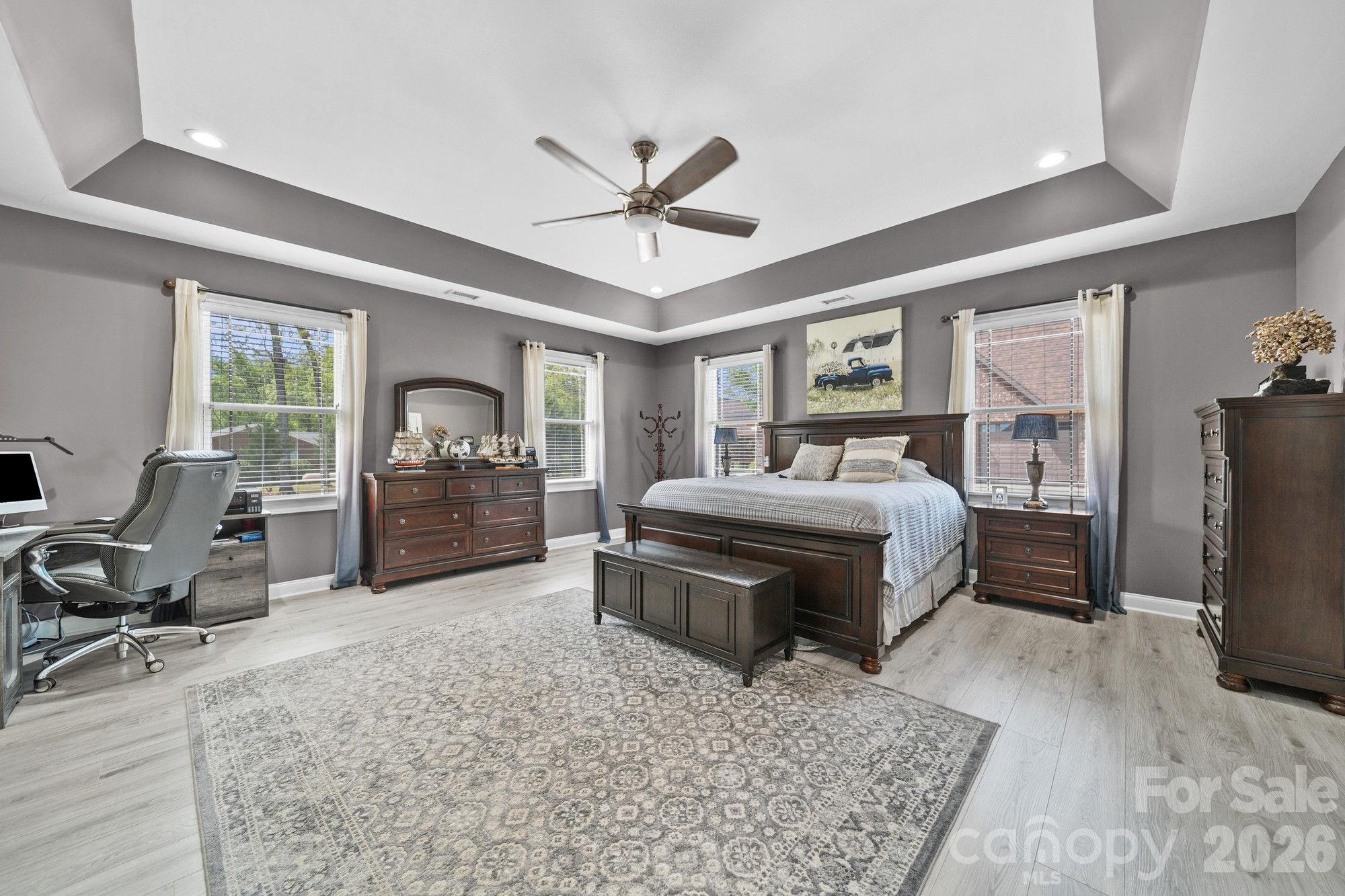 617 Caudle Road Peachland, NC 28133 - Photo 22 of 48 a bedroom with a large bed and a flat tv screen