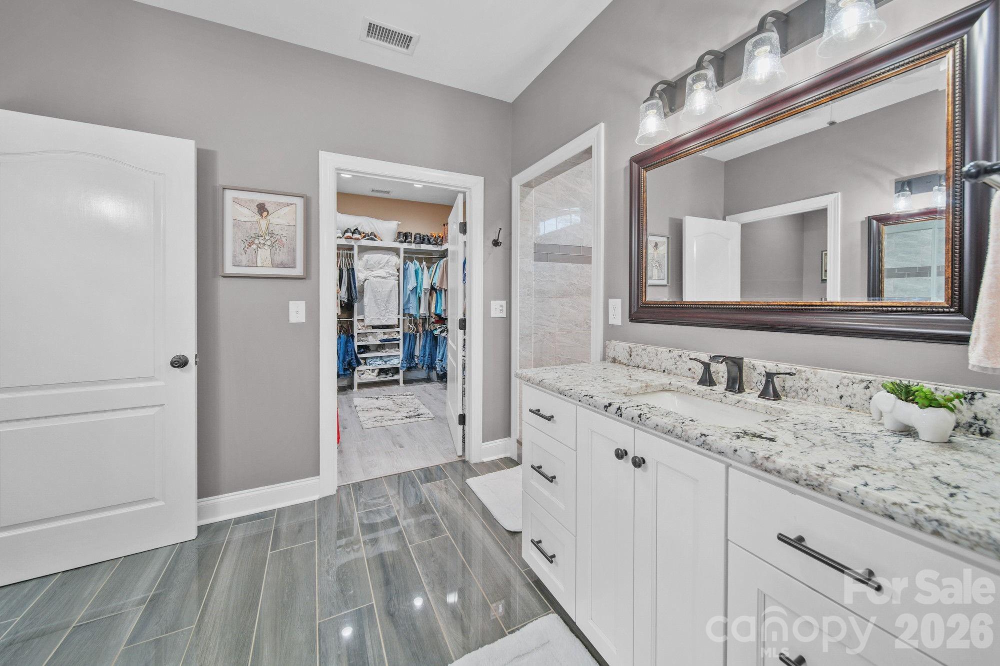 617 Caudle Road Peachland, NC 28133 - Photo 24 of 48 a bathroom with a sink a mirror and a shower