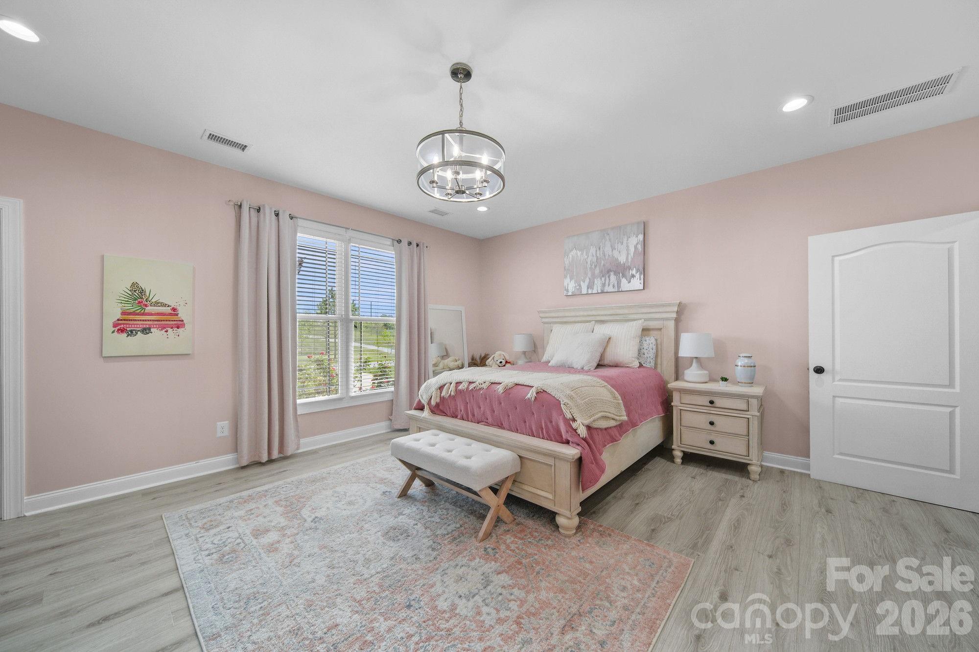 617 Caudle Road Peachland, NC 28133 - Photo 29 of 48 a spacious bedroom with a bed and a window