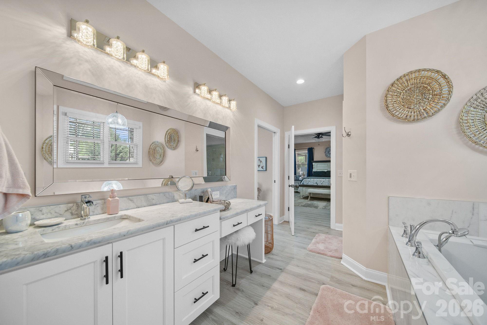 617 Caudle Road Peachland, NC 28133 - Photo 30 of 48 a spacious bathroom with a double vanity sink double and a mirror