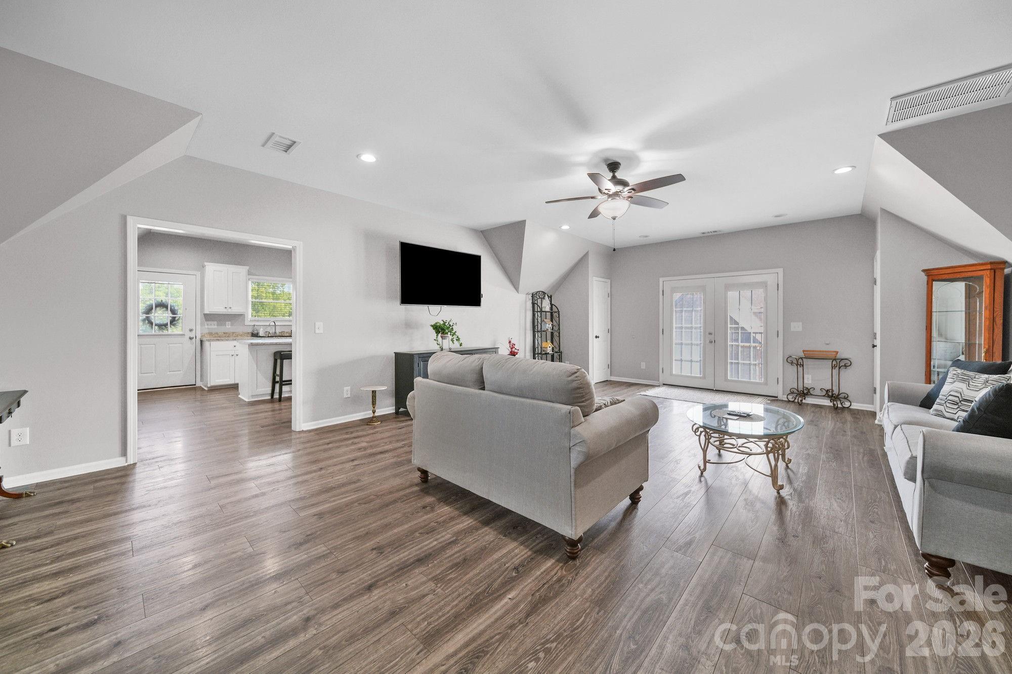 617 Caudle Road Peachland, NC 28133 - Photo 39 of 48 a living room with furniture a fireplace and a flat screen tv
