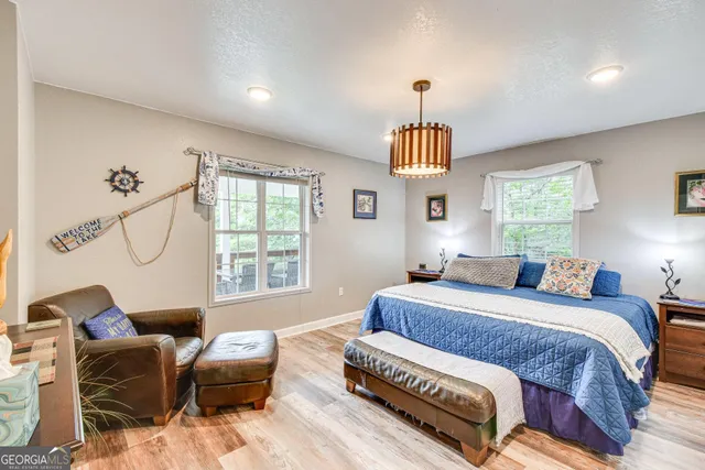 a bedroom with furniture and a window