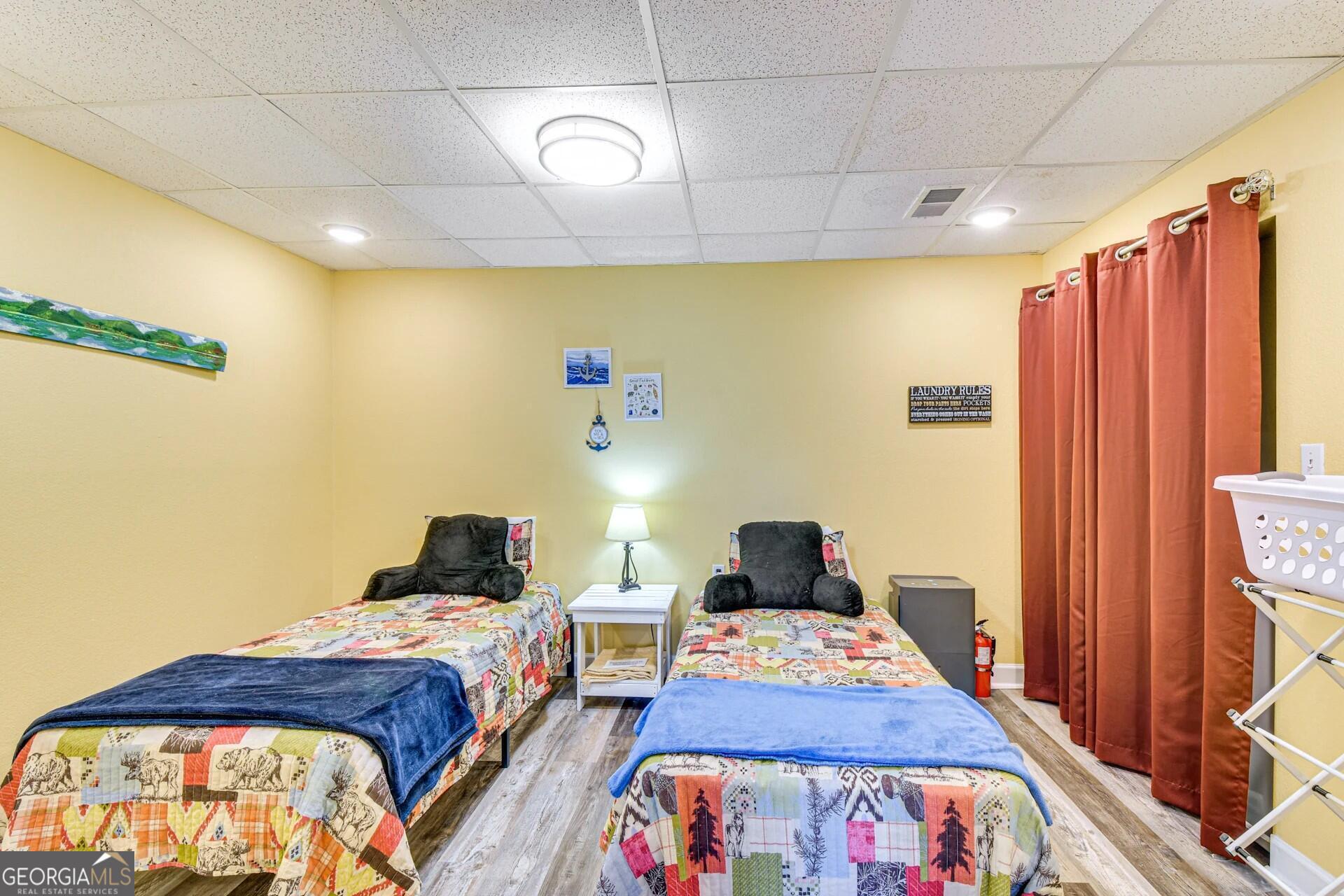 1912 Bearmeat Village Road Hiawassee, GA 30546 - Photo 18 of 23 a bedroom with a bed and wooden floor