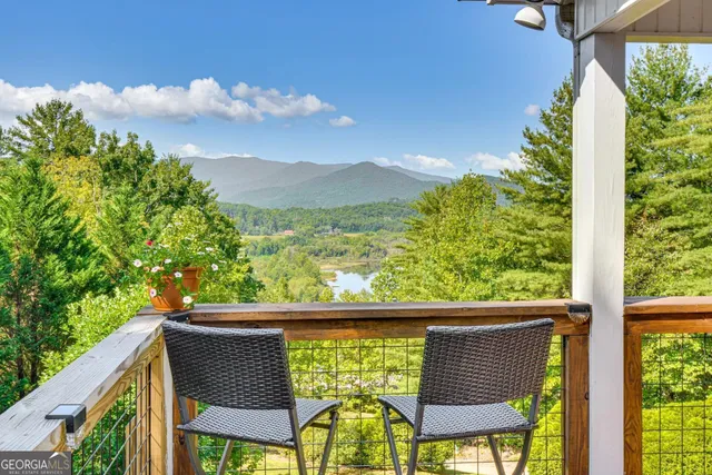 a view of a chair and table in the balcony