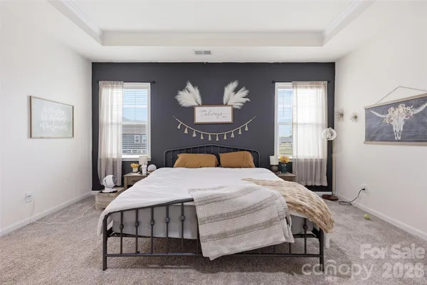 a bedroom with a bed and window