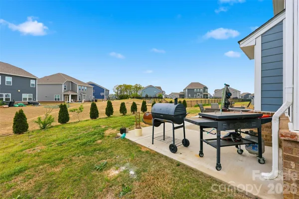 a view of a chairs and table in the patio
