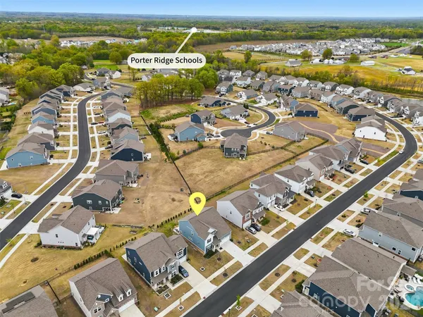 an aerial view of residential building with outdoor space ocean view