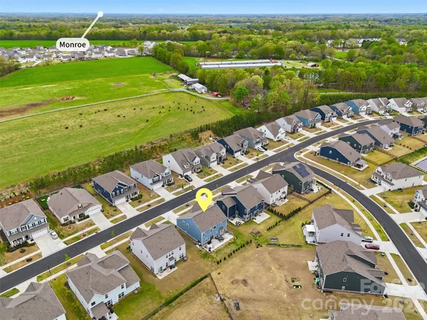 an aerial view of a city with ocean view