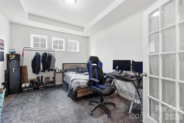 a bed room with furniture and a window