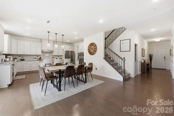 a view of a dining area with furniture and wooden floor
