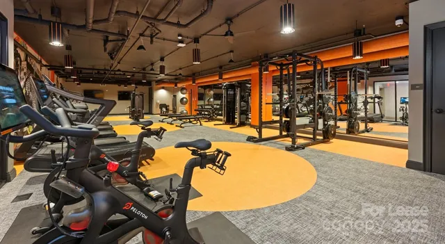 a kitchen with stainless steel appliances granite countertop a sink a stove and a refrigerator