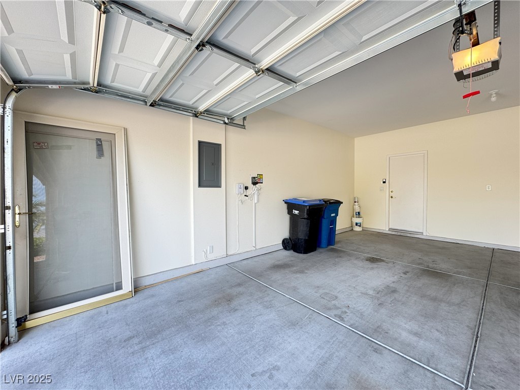 3013 Hartsville Road Henderson, NV 89052 - Photo 12 of 43 Garage featuring a garage door opener and electric panel