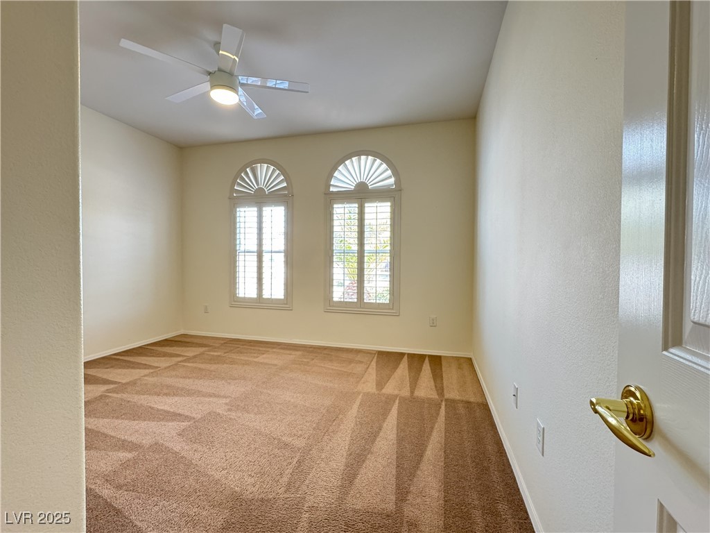 3013 Hartsville Road Henderson, NV 89052 - Photo 15 of 43 Carpeted spare room with baseboards and ceiling fan