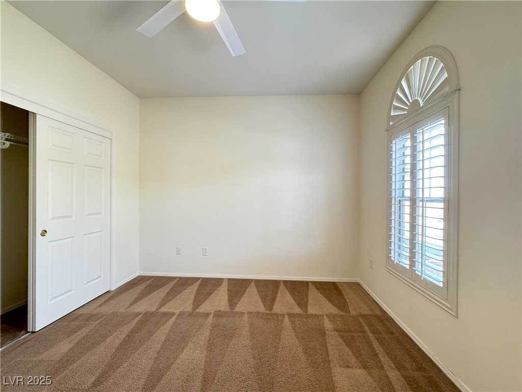 3013 Hartsville Road Henderson, NV 89052 - Photo 16 of 43 Unfurnished room with baseboards, carpet, and a ceiling fan