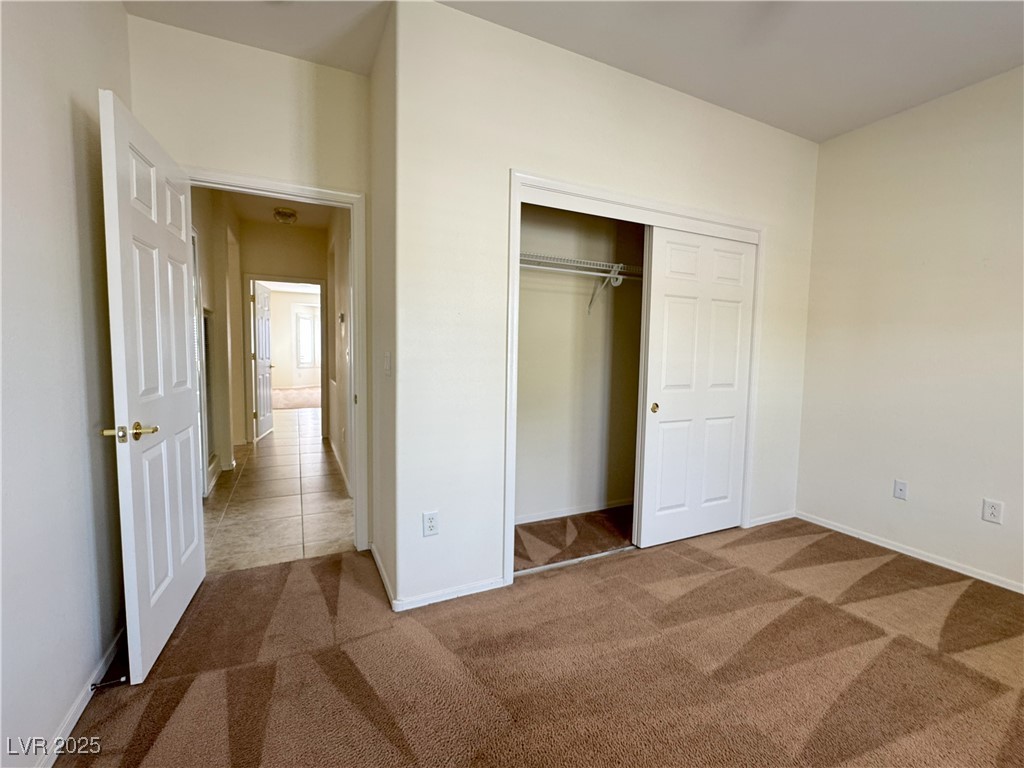 3013 Hartsville Road Henderson, NV 89052 - Photo 17 of 43 Unfurnished bedroom with carpet, a closet, and baseboards