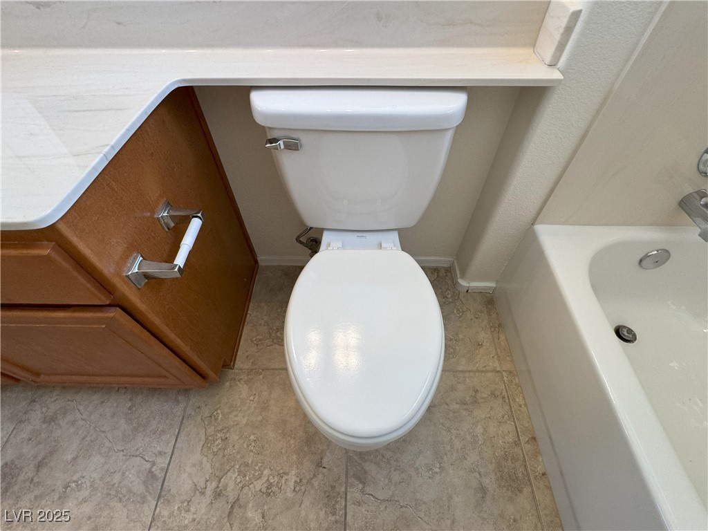3013 Hartsville Road Henderson, NV 89052 - Photo 22 of 43 Bathroom featuring a bath and toilet