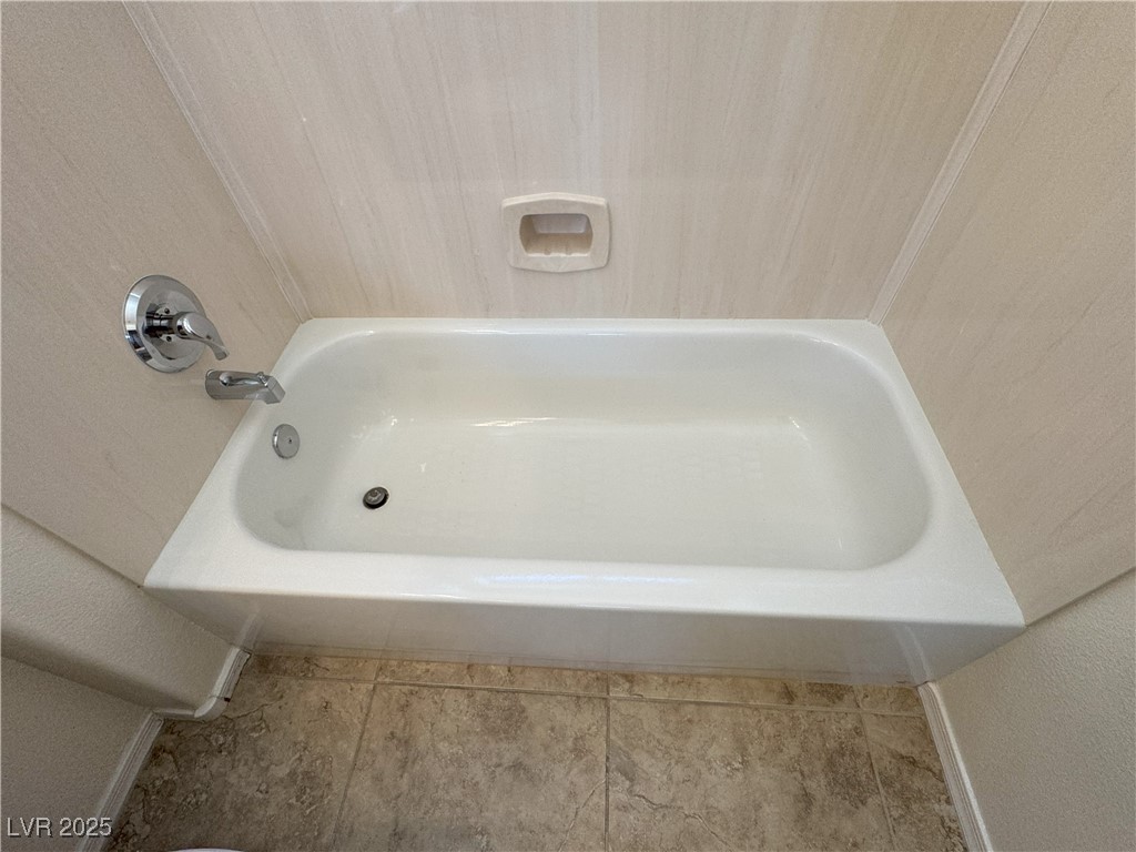 3013 Hartsville Road Henderson, NV 89052 - Photo 23 of 43 Bathroom featuring baseboards and a washtub