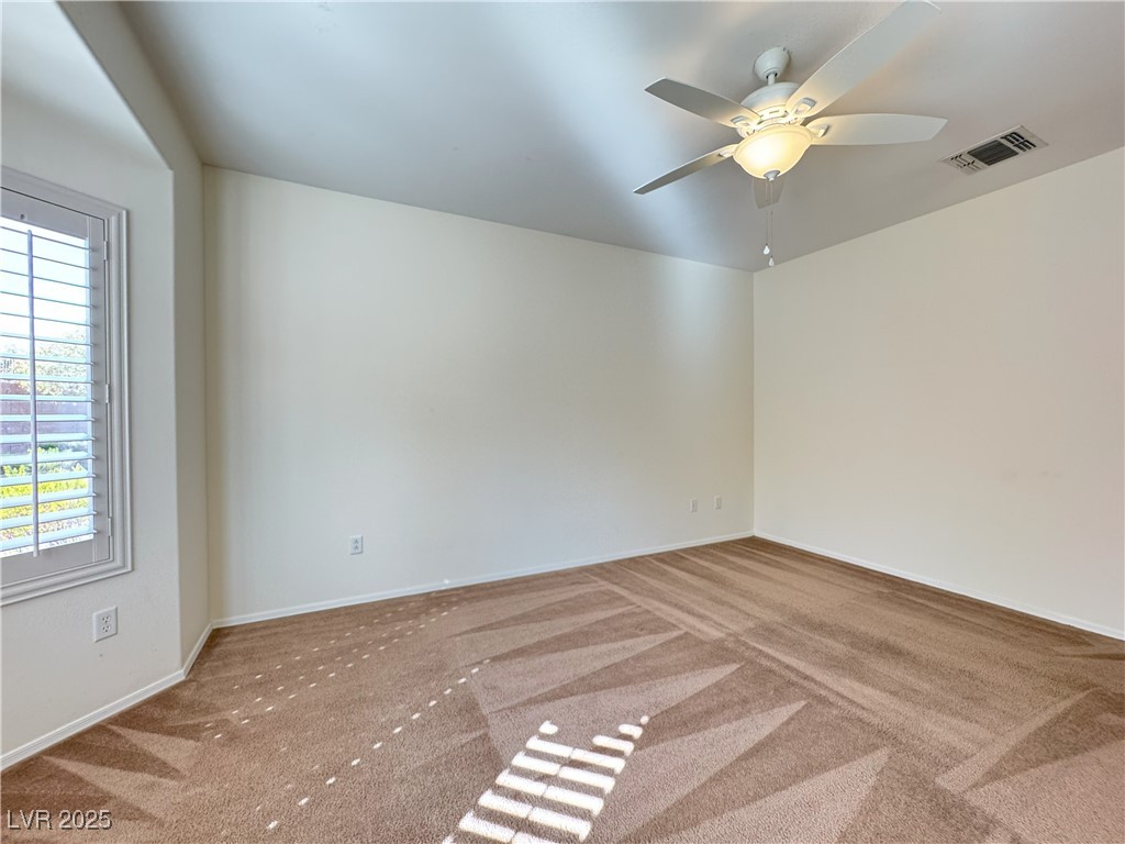 3013 Hartsville Road Henderson, NV 89052 - Photo 26 of 43 Unfurnished room featuring baseboards, carpet floors, ceiling fan, and visible vents