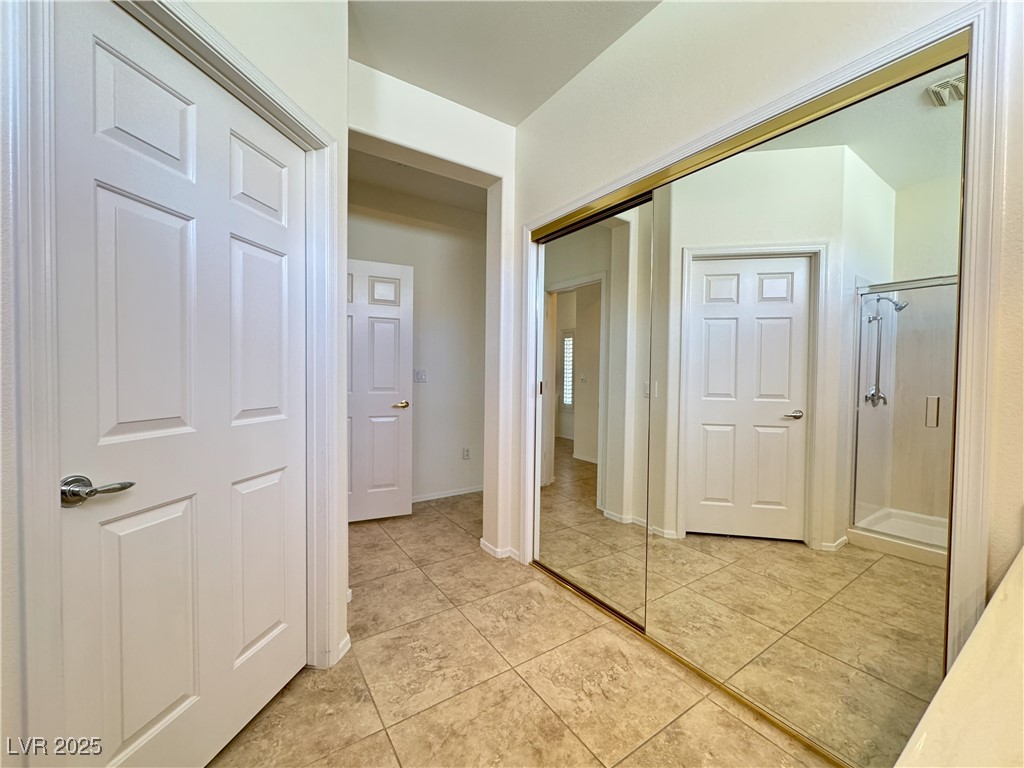 3013 Hartsville Road Henderson, NV 89052 - Photo 29 of 43 Hallway with light tile patterned flooring and baseboards