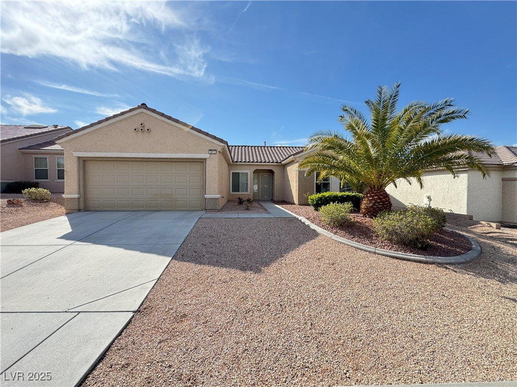 3013 Hartsville Road Henderson, NV 89052 - Photo 3 of 43 View of front of property with stucco siding, a garage, a tiled roof, and concrete driveway