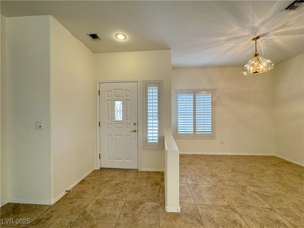 3013 Hartsville Road Henderson, NV 89052 - Photo 31 of 43 Foyer featuring baseboards, visible vents, and light tile patterned floors