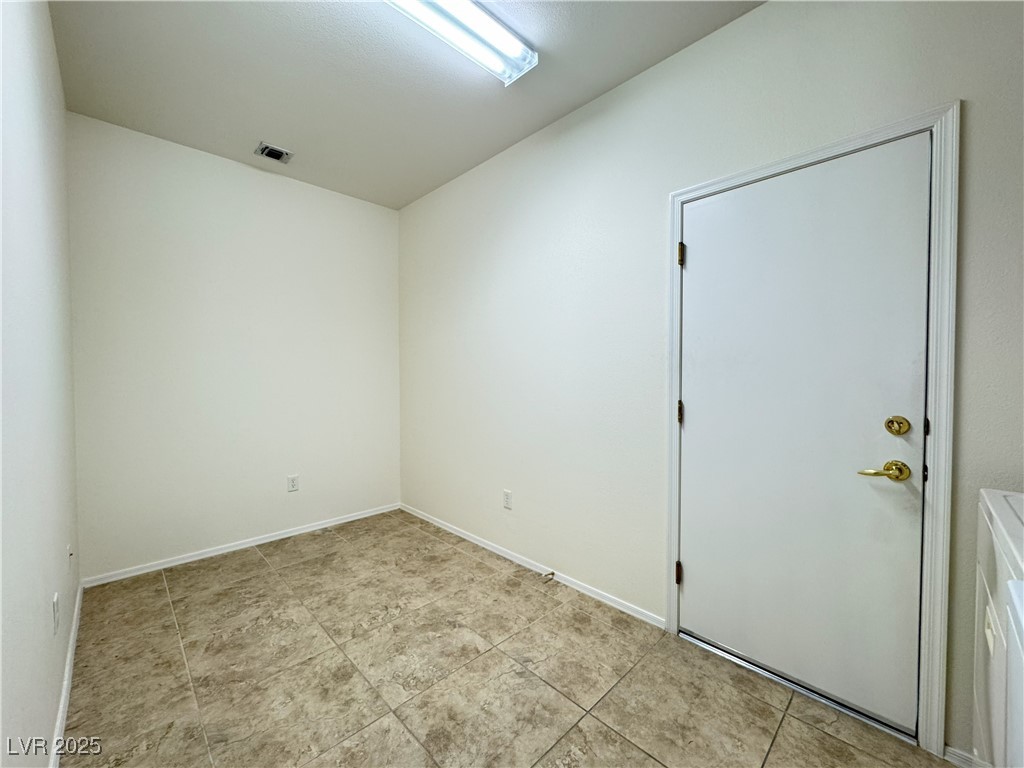 3013 Hartsville Road Henderson, NV 89052 - Photo 41 of 43 Spare room featuring light tile patterned flooring, baseboards, and visible vents