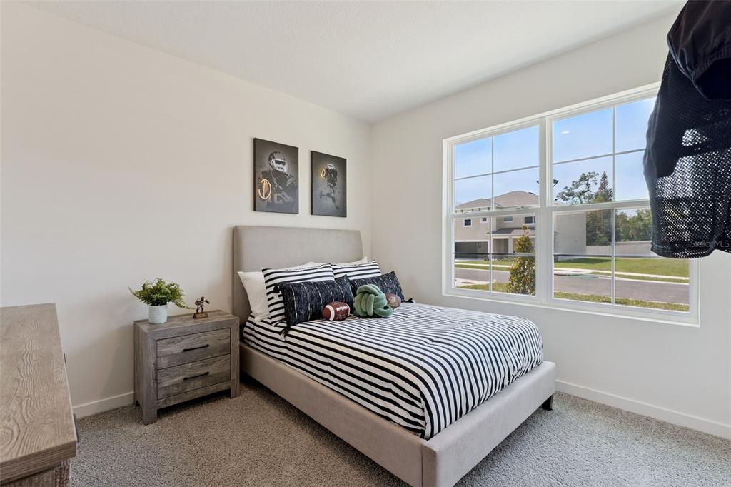 5115 Nickerbean Street Apopka, FL 32712 - Photo 11 of 16 a bedroom with a bed and a window