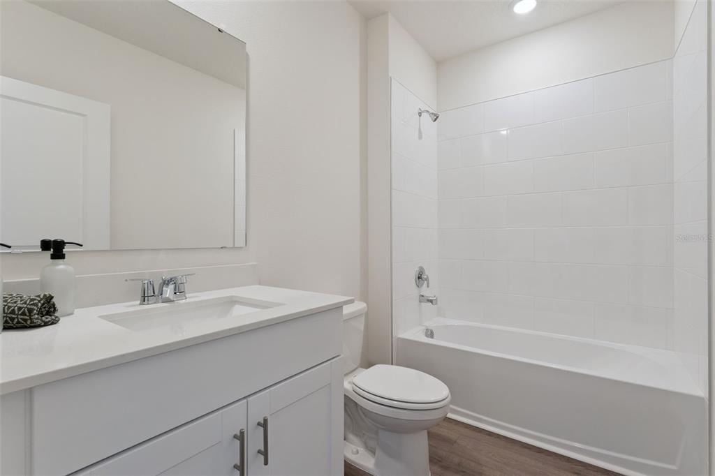 5115 Nickerbean Street Apopka, FL 32712 - Photo 12 of 16 a bathroom with a sink toilet and shower