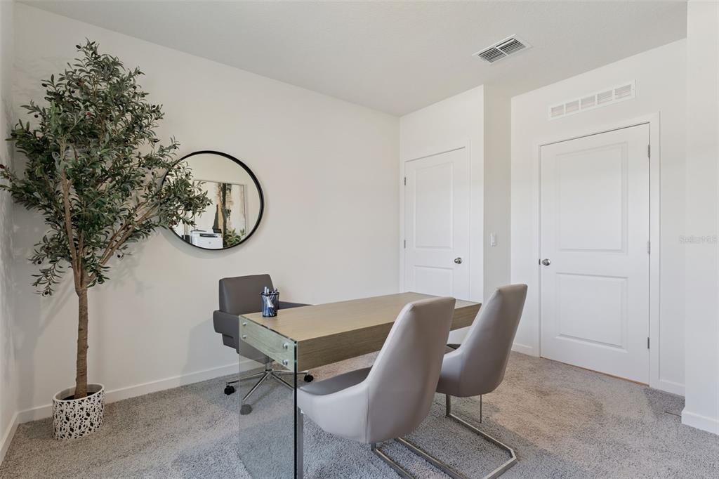 5115 Nickerbean Street Apopka, FL 32712 - Photo 15 of 16 a view of a room with a table and chairs