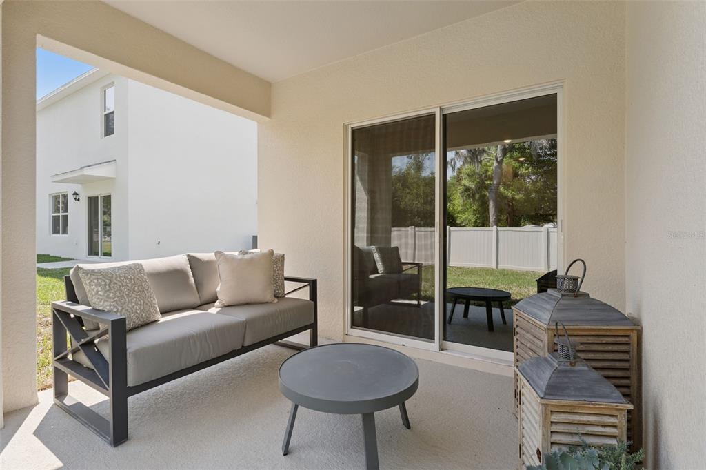 5115 Nickerbean Street Apopka, FL 32712 - Photo 16 of 16 a living room with furniture and a floor to ceiling window