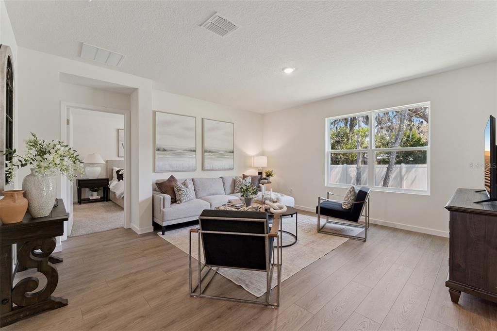 5115 Nickerbean Street Apopka, FL 32712 - Photo 3 of 16 a living room with furniture and a window