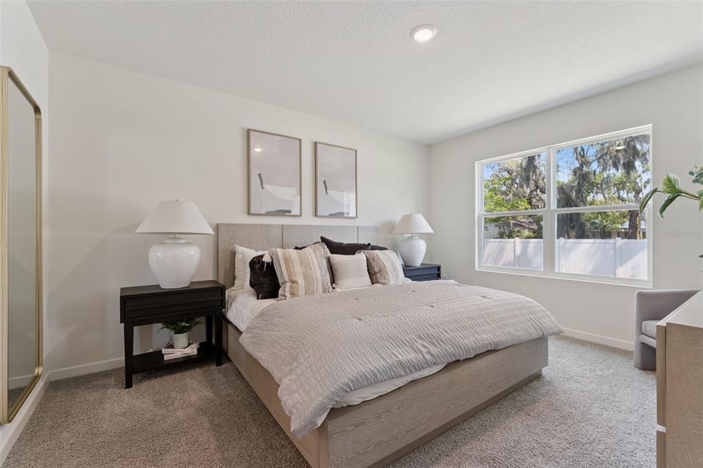 5115 Nickerbean Street Apopka, FL 32712 - Photo 9 of 16 a bedroom with a bed and a window