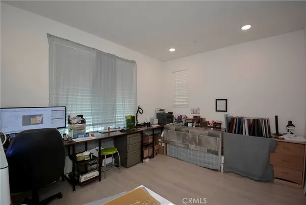 a reading room with furniture and rug