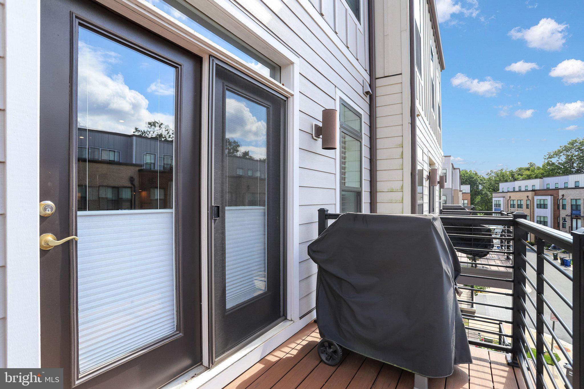 1662 Bandit Loop, Unit 3B Reston, VA 20190 - Photo 8 of 47 Atrium Door to Great Room w/ pleated shades