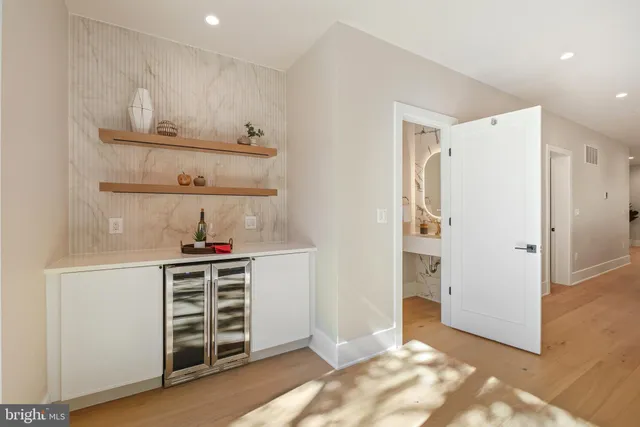 a view of kitchen with furniture and white refrigerator