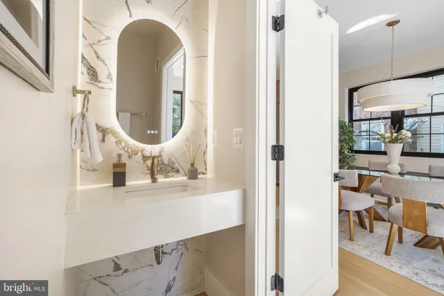 a view of living room with furniture and a mirror