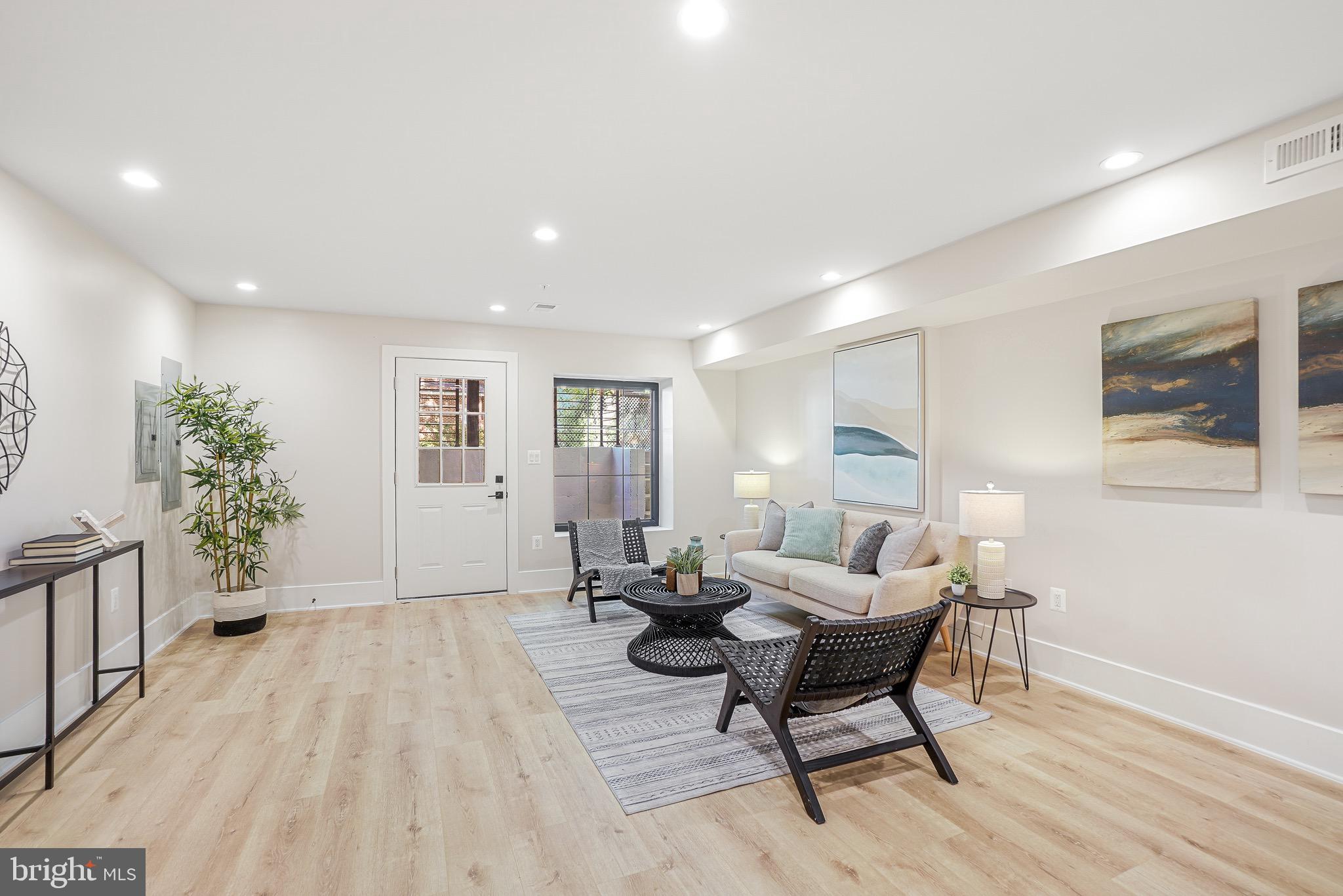 4414 Harrison Street Northwest Washington, DC 20015 - Photo 28 of 46 a living room with furniture and wooden floor