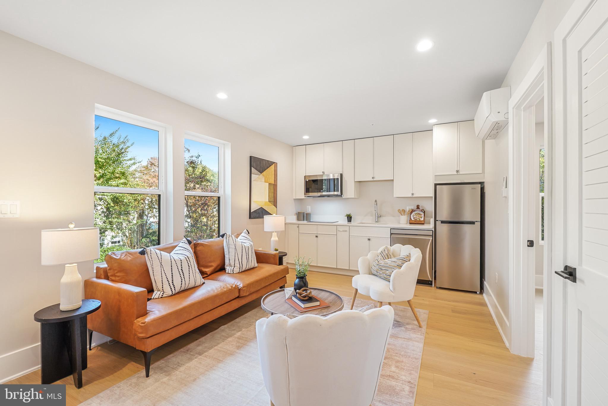 4414 Harrison Street Northwest Washington, DC 20015 - Photo 33 of 46 a living room with furniture and a large window