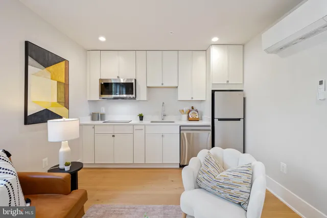 a kitchen with a sink cabinets and appliances