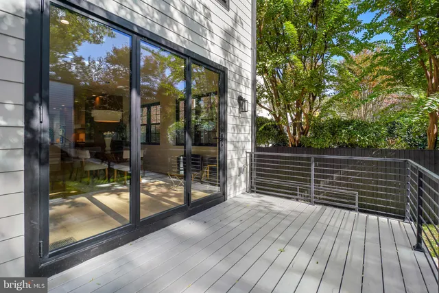 a balcony view with a glass door