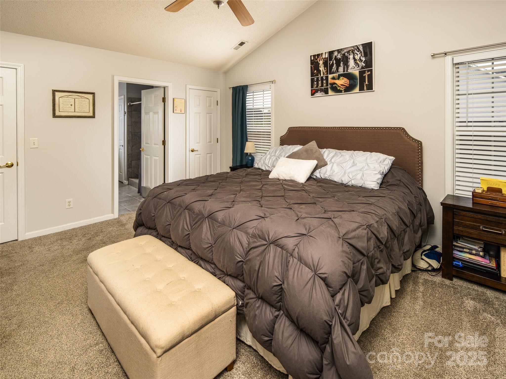 141 Black River Road Fletcher, NC 28732 - Photo 13 of 32 a bedroom with a bed and a couch